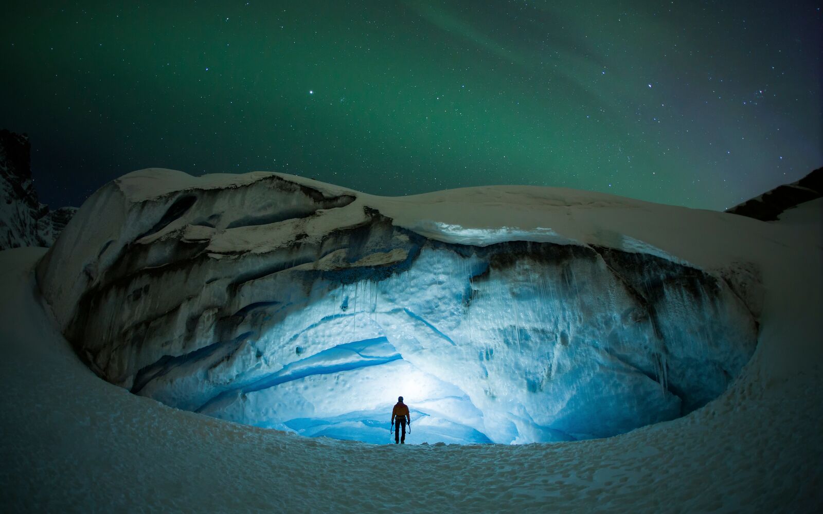 Ice climbing under aurora